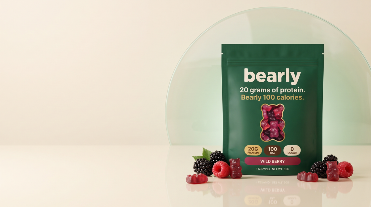 Bearly Wild Berry protein gummies pouch on a cream backdrop with fresh berries and red gummy bears.